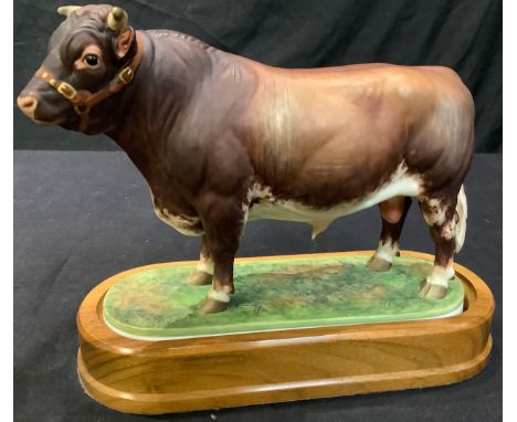 A Royal Worcester model, Dairy Shorthorn Bull, modelled by Doris Lindner, mounted of wooden base, 22cm high overall 