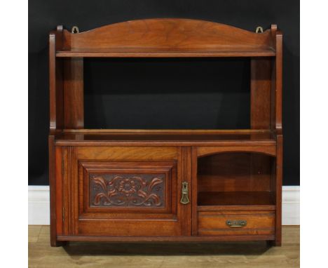 A Victorian Aesthetic Movement walnut salon wall cabinet, arched cresting above an open shelf, a porcelain niche, small drawe