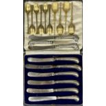 ASSORTMENT OF CUTLERY, including six George V silver gilt teaspoons, Henry James Hulbert, London