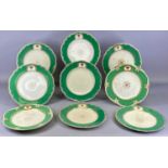 CHAMBERLAIN & CO. WORCESTER SET OF NINE ARMORIAL PLATES, with green glazed and gilded border,