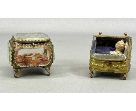 19TH CENTURY FRENCH GILDED BRASS TRINKET BOXES, one with sloping glass hinged cover and plush lined interior, main body embos