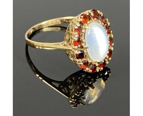 9CT GOLD RING WITH CENTRAL MOONSTONE, garnet surround, size O, 2.9gmsProvenance: private collection Conwy