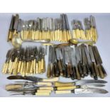 LARGE ASSORTMENT OF ANTIQUE CUTLERY, including bone handled knives and forks, various carving