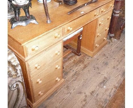 Light oak kneehole nine-drawer pedestal desk