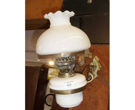 Edwardian brass wall oil lamp (converted), having white glass reservoir and shade