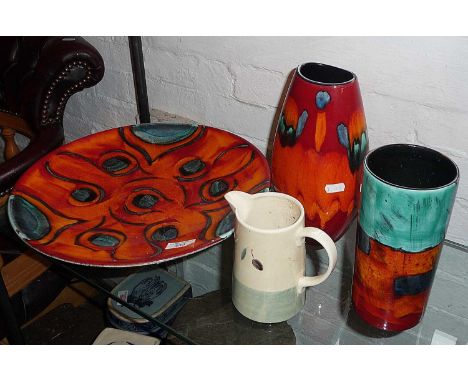 Large Poole Pottery charger, two similar vases, inc. Volcano pattern and a 'Fresco' Poole Pottery milk jug