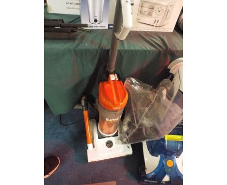 A Vax Advance Carpet Cleaner and a Vacuum Cleaner  