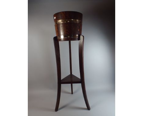 An Edwardian Brass Banded Oak Pot Plant Holder on Tripod Base, 90cm high 