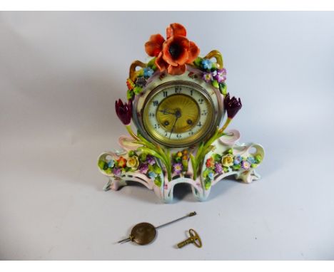 A Continental Porcelain Mantle Clock Decorated with Flowers, 31cm High  