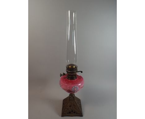 A Victorian Brass Based Oil Lamp with Coloured Opaque Glass Reservoir and Duplex Controls