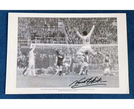 Norman Hunter signed 20x13 black and white print. Norman Bite Yer Legs Hunter leaps for joy as Allan Clarke scores the goal t