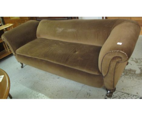 Early 20th Century upholstered Chesterfield type drop arm sofa on brass cups and ceramic casters.(B.P. 24% incl. VAT)