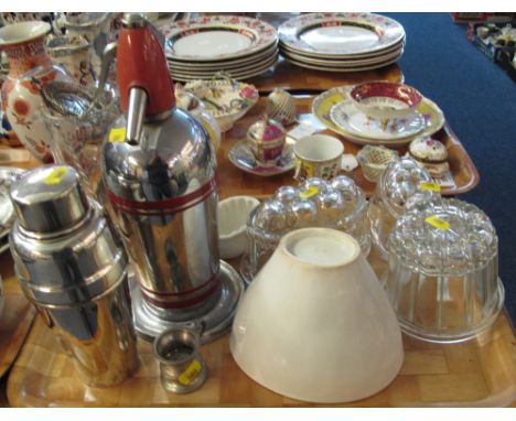 Tray of assorted kitchenalia items to include: glass and ceramic jelly moulds; plated cocktail shaker; water jug with swizzle