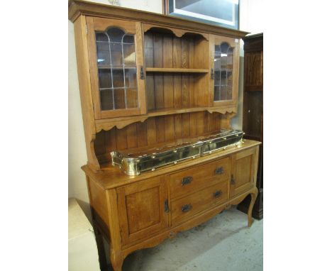 Early 20th Century oak two stage, cabinet backed, lead glazed dresser, standing on cabriole legs.(B.P. 24% incl. VAT)