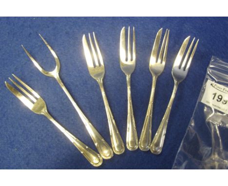 Set of five silver cake forks with similar design silver hors  d'oeuvres two pronged fork. (6)(B.P. 24% incl. VAT)