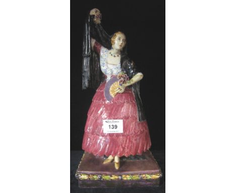 Large pottery study of a female with cloak flowers and fan on rectangular purple base.  Unmarked.(B.P. 24% incl. VAT)