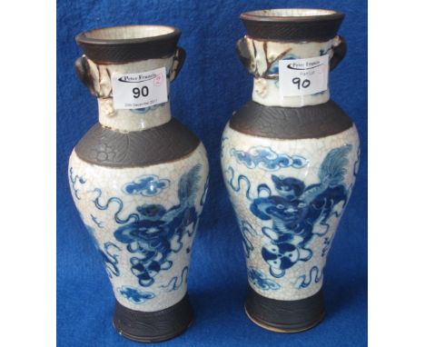 Two similar late 19th Century Chinese crackle glazed baluster shaped vases decorated under glazed blue with stylized Cymera p
