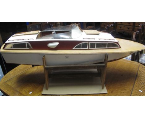 Wooden model of a Fairey centre cockpit motor cruiser, having single cylinder petrol engine and appearing remote control. (B.
