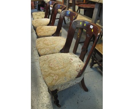 Set of four late Victorian mahogany upholstered dining chairs on ring turned legs and casters. (4)(B.P. 24% incl. VAT)