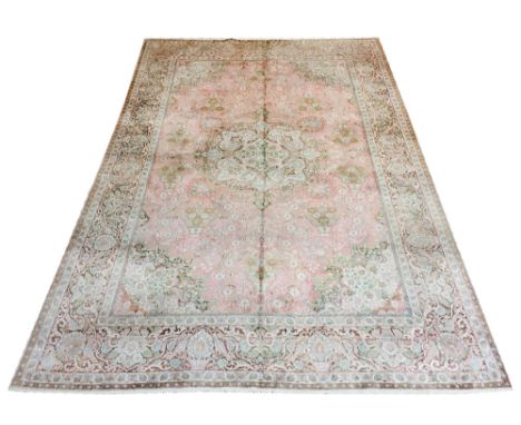 PURE SILK TEHRAN DESIGN CARPET, 320cm x 218cm, central medallion on a rose pink field of flowerheads and vines within corresp