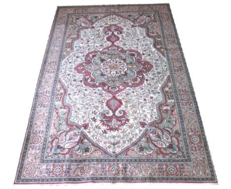 FINE VINTAGE PERSIAN TABRIZ DESIGN CARPET, 297cm x 194cm, pendant medallion on an ivory field of scrolling vines and flowerhe