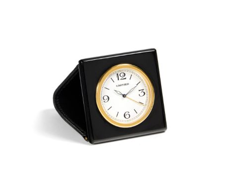 CARTIER TRAVEL WATCH, 80S Case: signed, n. 013458HF, lacquered and gilded metal, leather case. Dial: signed, white, Arabic nu