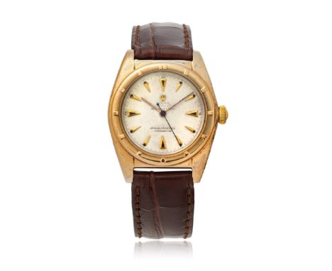 ROLEX "BUBBLE-BACK" REF. 5015 IN GOLD RETAILED SERPICO Y LAINO, 40S Case: signed, in 14K gold, screwed caseback marked 5015. 