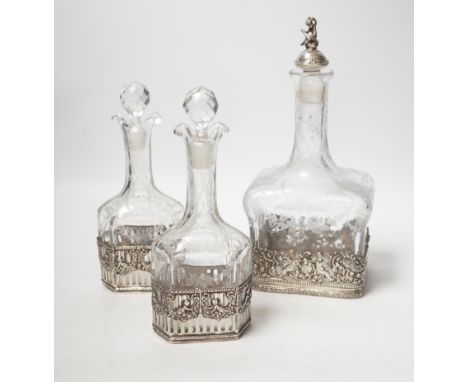 A George V Hanau silver mounted etched glass three piece decanter suite, import marks for Berthold Hermann Muller, London, 19