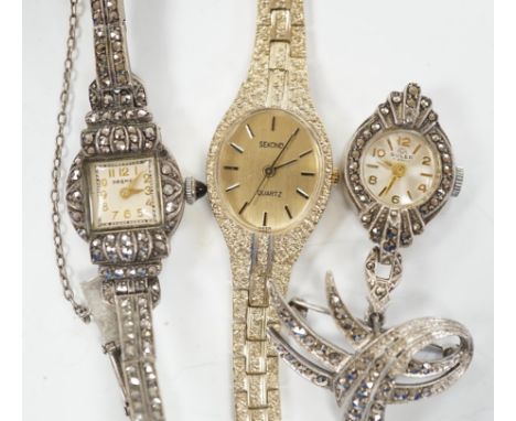 A late 1950's silver and marcasite set Premex manual wind cocktail watch, a similar lapel watch and a lady's Sekonda quartz w