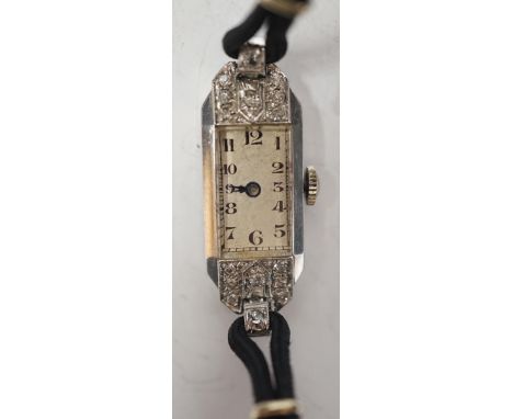 A lady's mid 20th century white metal, inscribed 'All Platinum' and diamond chip set rectangular manual wind cocktail wrist w