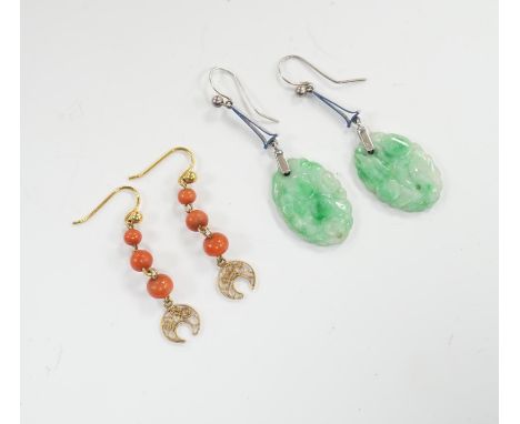 A pair of  9ct white metal and carved oval jade set drop earrings, jade 21mm and a pair of yellow metal and graduated three s