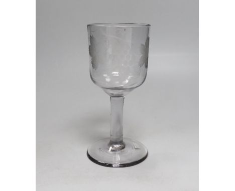 An English lead crystal goblet, c.1740-50, ogee bowl with tool marks, engraved fruiting vines and a bird, with a plain stem, 