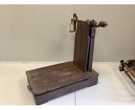 A set of Victorian oak and cast iron sack scales, height 85cm