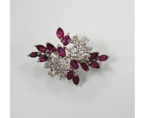 A modern white metal, ruby and diamond cluster set foliate spray pendant brooch, 32mm, gross weight 5.4 grams.