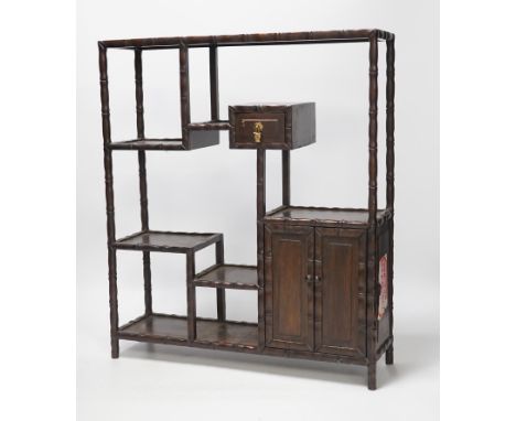 An early 20th century Chinese hongmu display shelf with cupboard and drawer, 46cm high