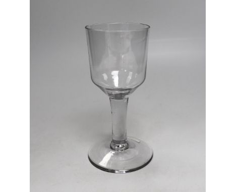 An English lead crystal goblet, c.1740-50, with blue tinge, the large ogee bowl is tool marked, the stem is plain and the con
