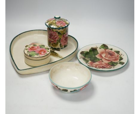 Wemyss ware - a roses preserve jar, three other items and an unusual  ‘hair tongs’ heart shaped dish, largest 30cm