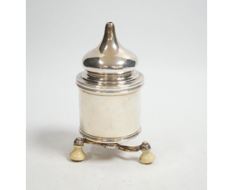 A French white metal pepper grinder on three ivory feet, height 11.5cm,&nbsp;CITES Submission reference: JWYF7WUN