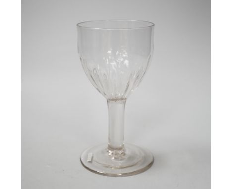 An English lead crystal flute moulded goblet, c,1740-50, a rare form with the lower half of the rounded ovoid bowl moulded wi