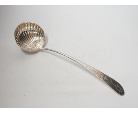 A George III Irish engraved silver soup ladle, John Shiels?, Dublin, 1793, 36cm, with fluted bowl,