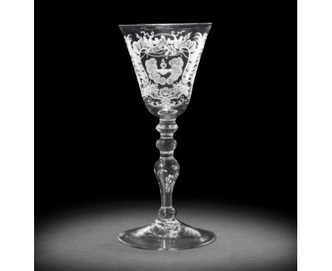 A good Dutch engraved light baluster marriage glass, circa 1750-60The round funnel bowl finely decorated with a flaming heart