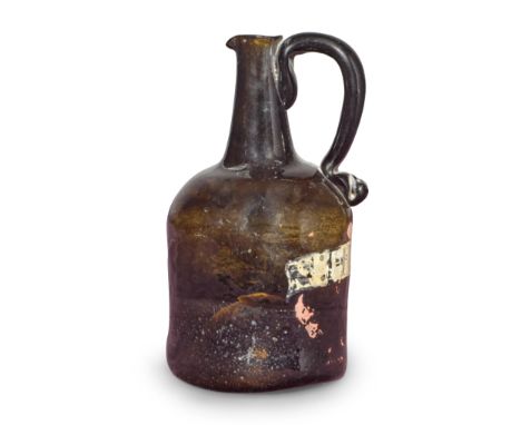 A rare gilded and enamelled 'Squat Cylinder' apothecary serving bottle, circa 1750Of olive-amber tint, the wide body with rou