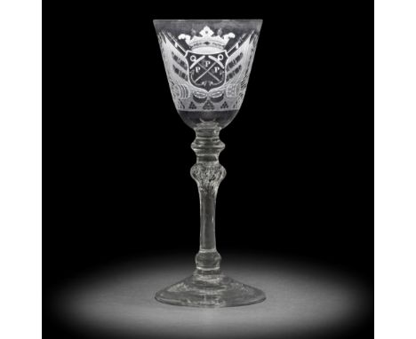 A fine Dutch engraved armorial light baluster 'Admiralty' wine glass attributed to Jacob Sang, circa 1760 The round funnel bo