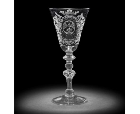 A very fine Dutch engraved light baluster marriage goblet, circa 1750-60The tall round funnel bowl engraved with a flaming he