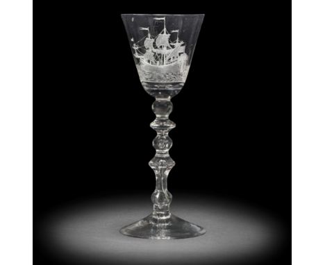 A fine Dutch engraved light baluster wine glass, circa 1750The round funnel bowl finely engraved with a continuous seascape d