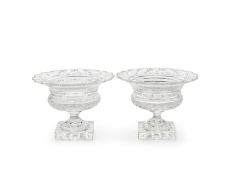 A fine pair of cut glass pedestal bowls, probably Irish, early 19th centuryOf circular form, the everted rims cut with fans a