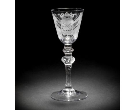 A fine Dutch engraved armorial light baluster 'Admiralty' wine glass attributed to Jacob Sang, circa 1760 The round funnel bo