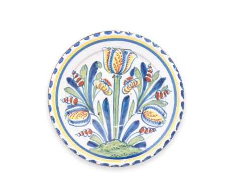 A good Brislington delftware tulip charger, circa 1700-20Of attractive small size, boldly painted in blue, green, yellow and 