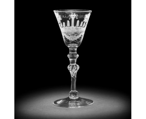 A Dutch engraved light baluster betrothal glass, circa 1750-60The round funnel bowl with a landscape vignette depicting a pai