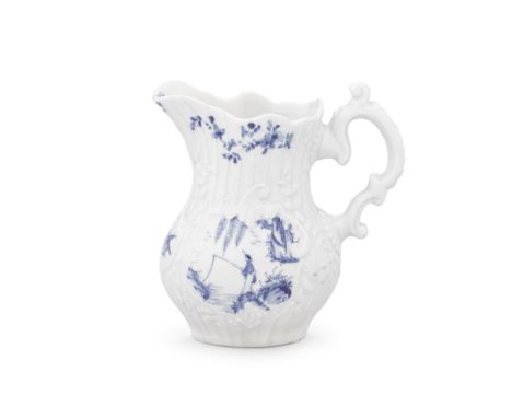 A Worcester milk jug, circa 1755Of strap-fluted form with crisp moulded detail, the handle moulded with a double scroll and w